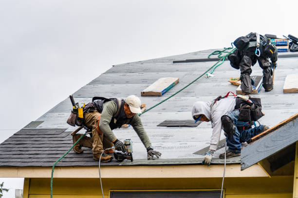 Professional Gutter Installation technician working in Roslyn, NY